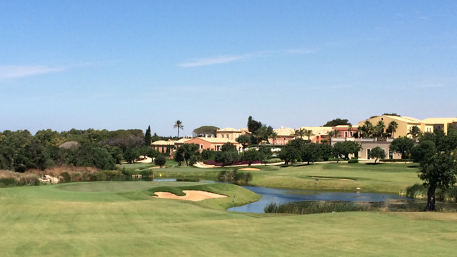Donnafugata Golf Resort & Spa's downhill par 5 #7 with the backdrop of the clubhouse. A Gary Player design, and just 4 years old, the course is in remarkable condition!