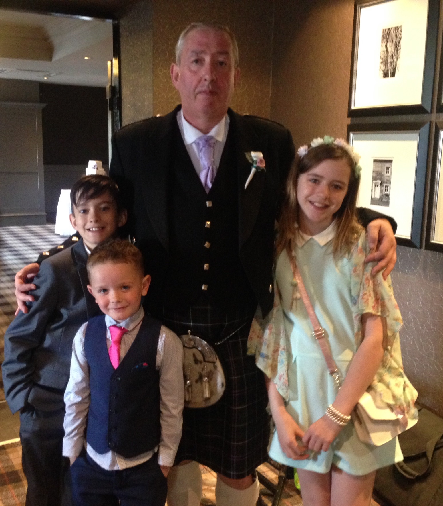 PerryGolf VIP Golf Coach Concierge Driver, Joe Marshall, with his lovely grandchildren at his son's wedding