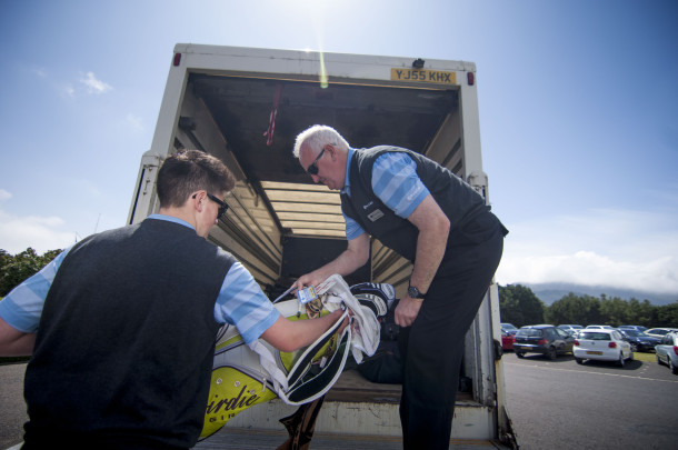 PerryGolf staff carefully transporting clients' clubs during PerryGolf's 2015 British Open Golf Cruise