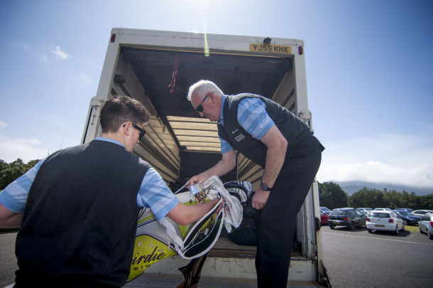 PerryGolf staff carefully transporting clients' clubs during PerryGolf's 2015 British Open Golf Cruise