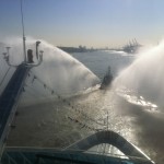 Azamara Quest is honoured with a water spraying tugboat escort for the final few miles of the beautiful River Elbe into the heart of Hamburg Germany