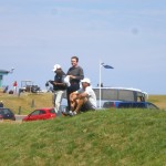 Mr. Venkatesh, Mr. Todd and Mr. Sawyer overlook the 18th green of the Torrance Course awaiting their wives. — in St Andrews, Scotland.