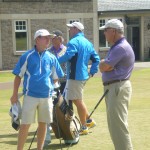 D. Baca and S. Thompson taking in some last minute advice from their caddies before starting their rounds at Kingsbarns Golf Links. — in St Andrews, Scotland.