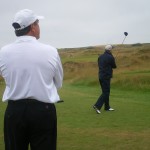 F. Mott tees off at the Castle Course as brother J. Mott watches on. — at Castle Course.