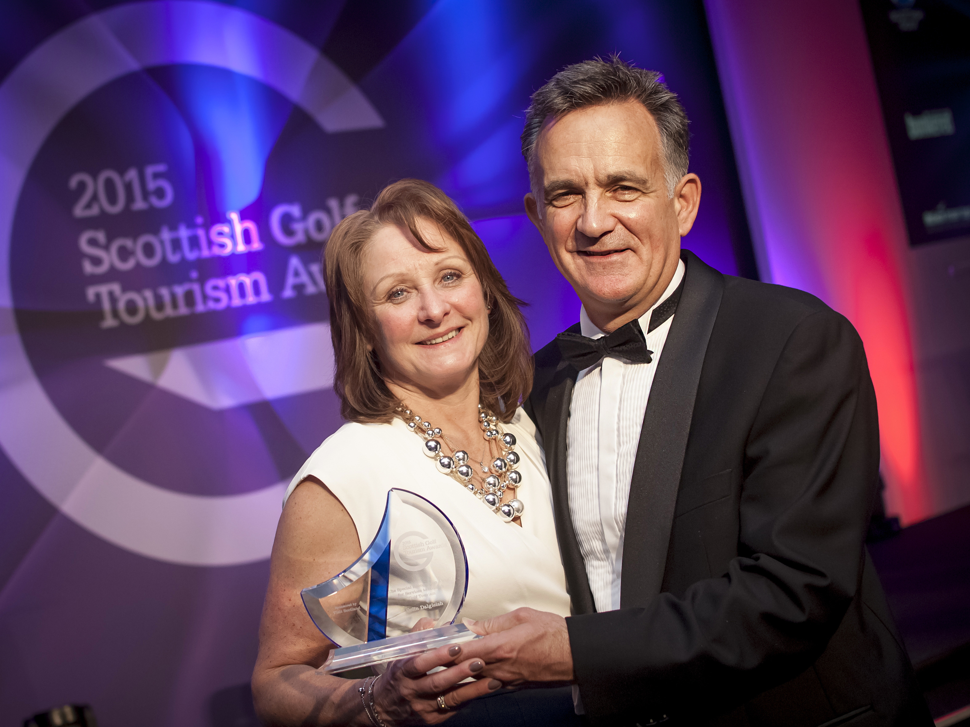 PerryGolf's Anne Filshie joins PerryGolf Co-Founder, Colin Dalgleish, in celebrating his receipt of a Special Recognition award at the 2015 Scottish Golf Tourism Awards