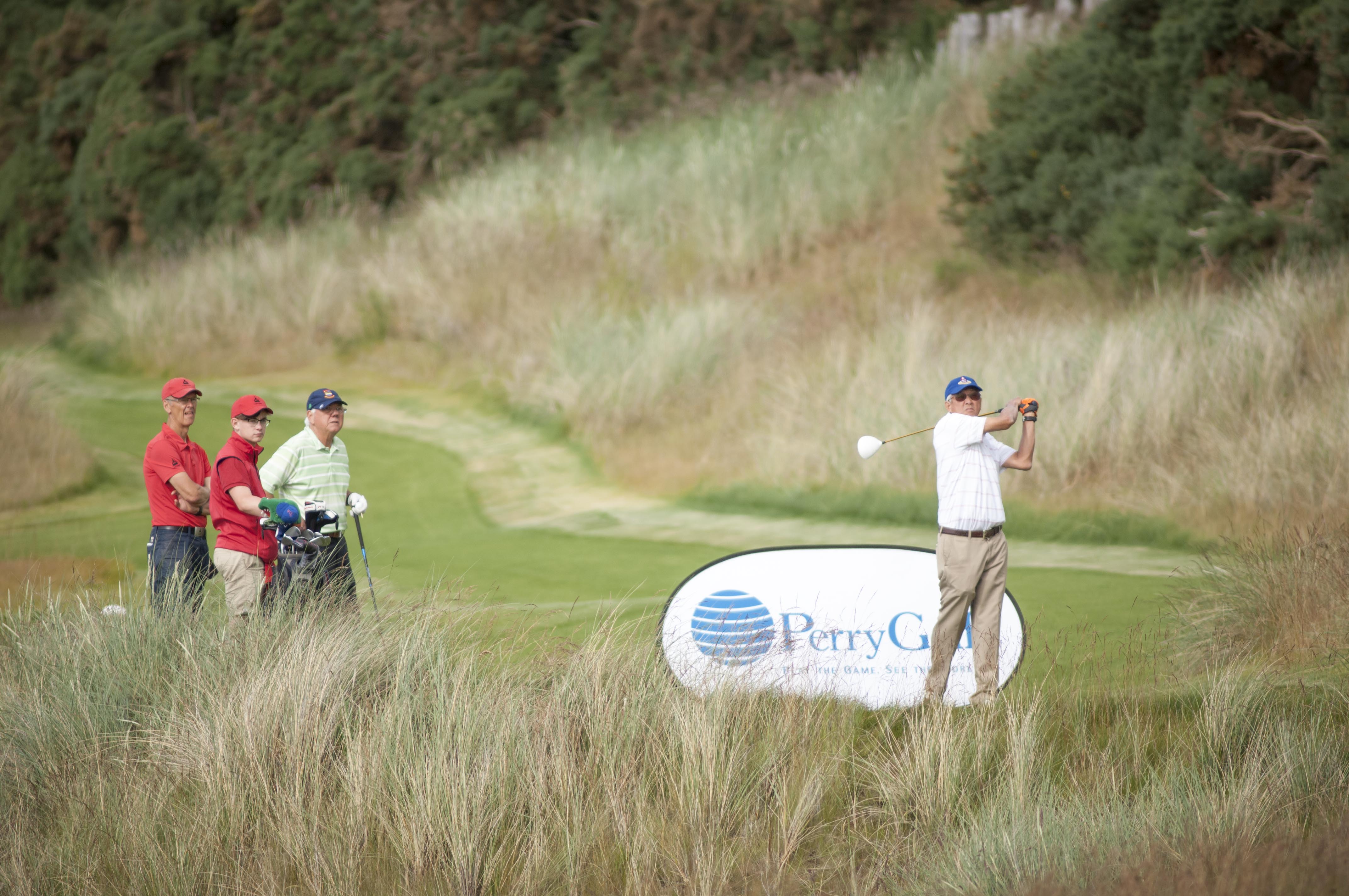 PerryGolf guest teeing off in Scotland at Castle Stuart Golf Links during our 2015 Open Championship Golf Cruise